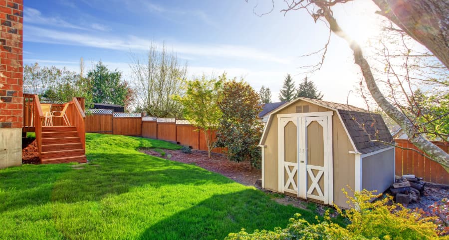 Fenced backyard with storage shed in Colorado Springs